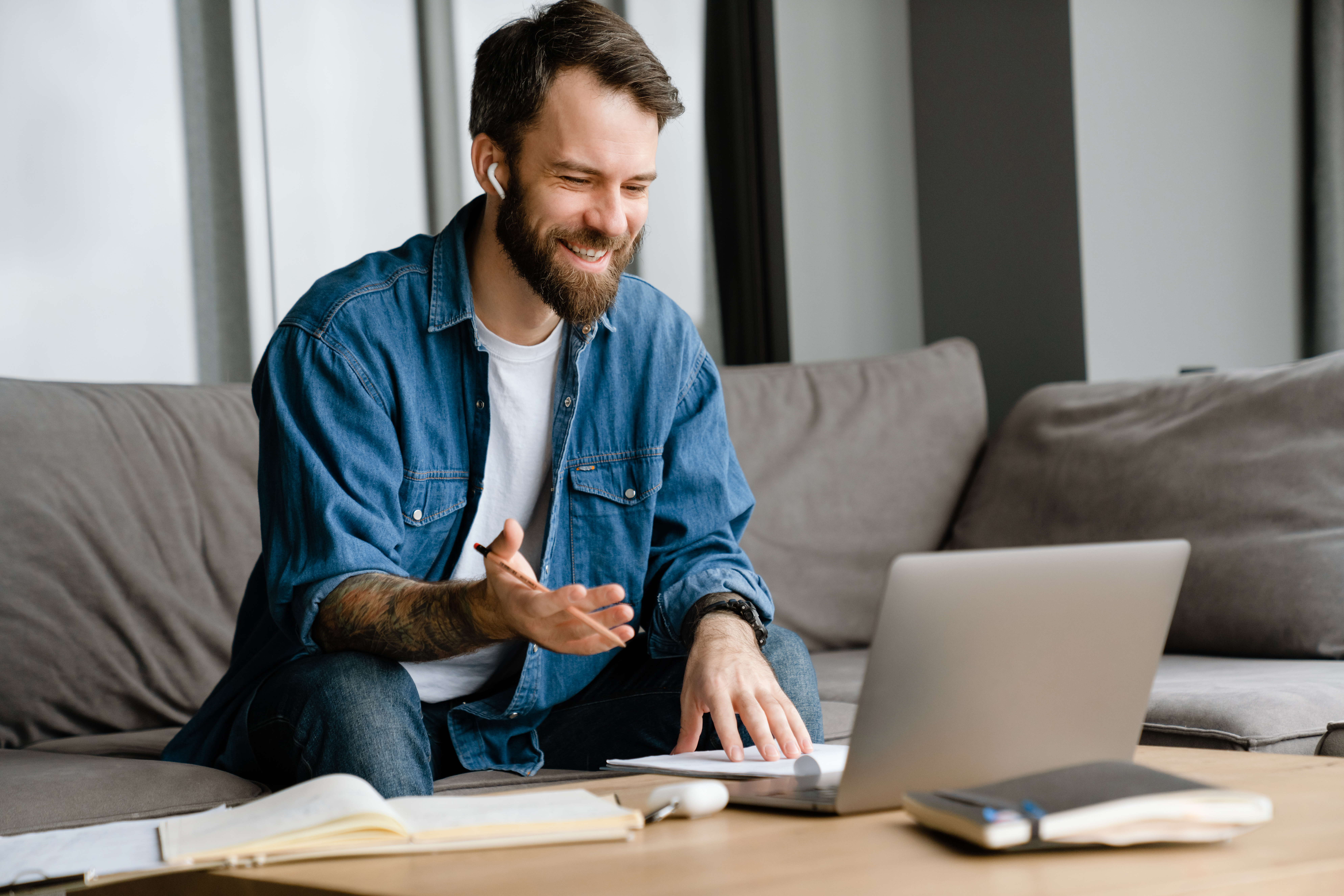 Smiling professional interacting enthusiastically during a virtual meeting, illustrating confidence and ease achieved through AI-enhanced financial close technology.